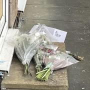 Floral tributes left outside the property
