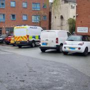 A police van and car outside the Millennium Centre on Thursday