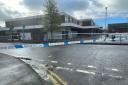 The initial police cordon at Four Acre shopping centre