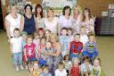 Goodbye Aunty Sandra (at centre), youngsters and mums at the playgroup will miss her
