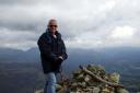 Standing tall: heart patient Steve Thomas at the summit of Wetherlam