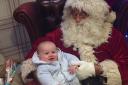 Henri Coady, four months, with Santa in Tyrers