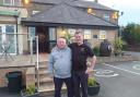 Landlord Paul Draper, with dad Alan outside the Junction this year, with the pub's extension visible in the background