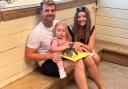 Laura, far right, with husband Dann and daughter Sienna