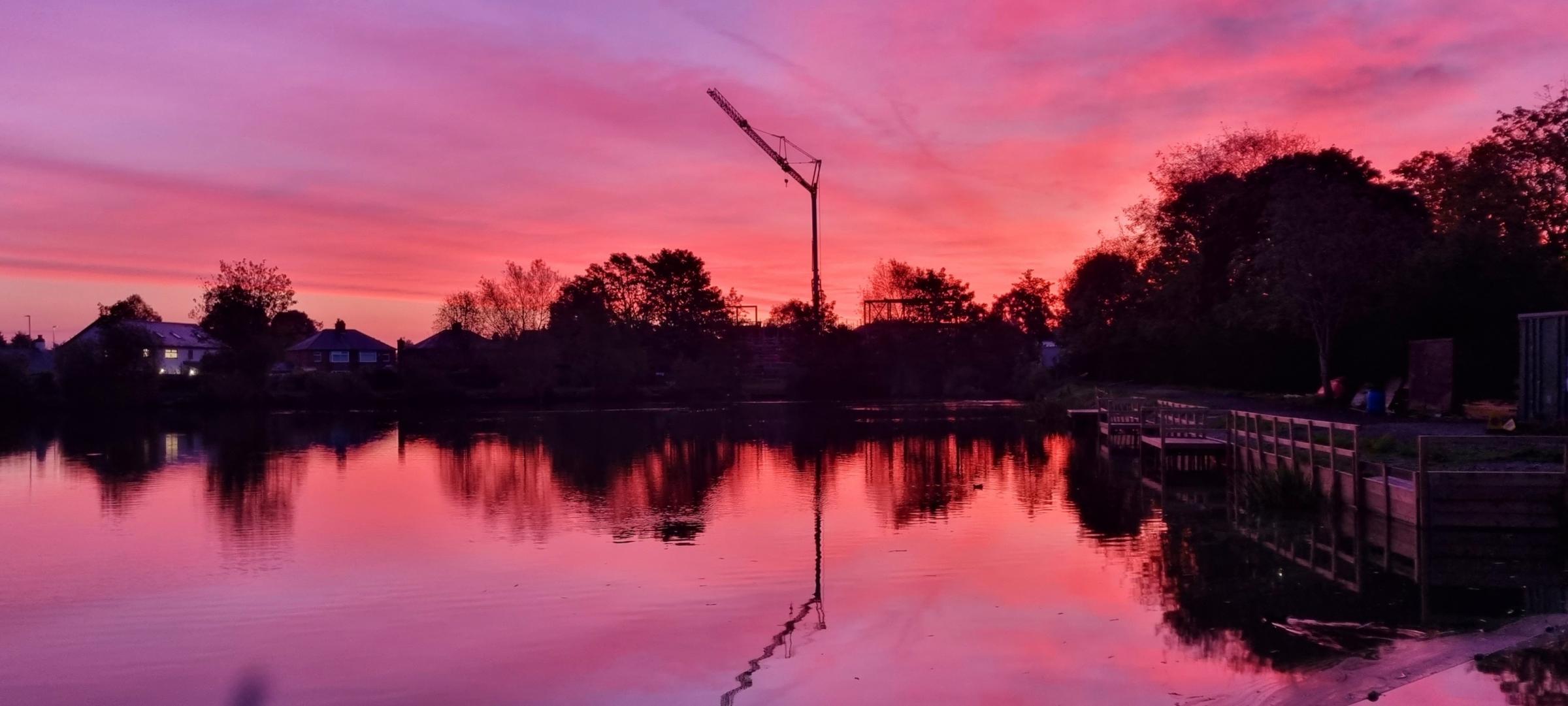 Sunrise over Carr Mill Dam by Mike Horton