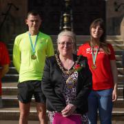 Mayor Cllr Lynne Clarke and the runners from St Helens Striders