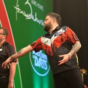 Michael Smith bowed out of the Bahrain Darts Masters at the semi-final stage