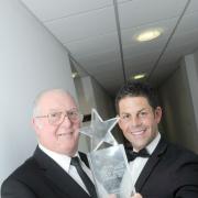 Bill is congratulated on his award by Garry Fortune, general manager at Haydock Park