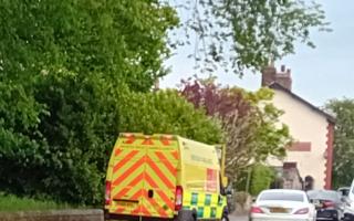 An ambulance van at the scene, on Millbrook Lane, near Mill Brow