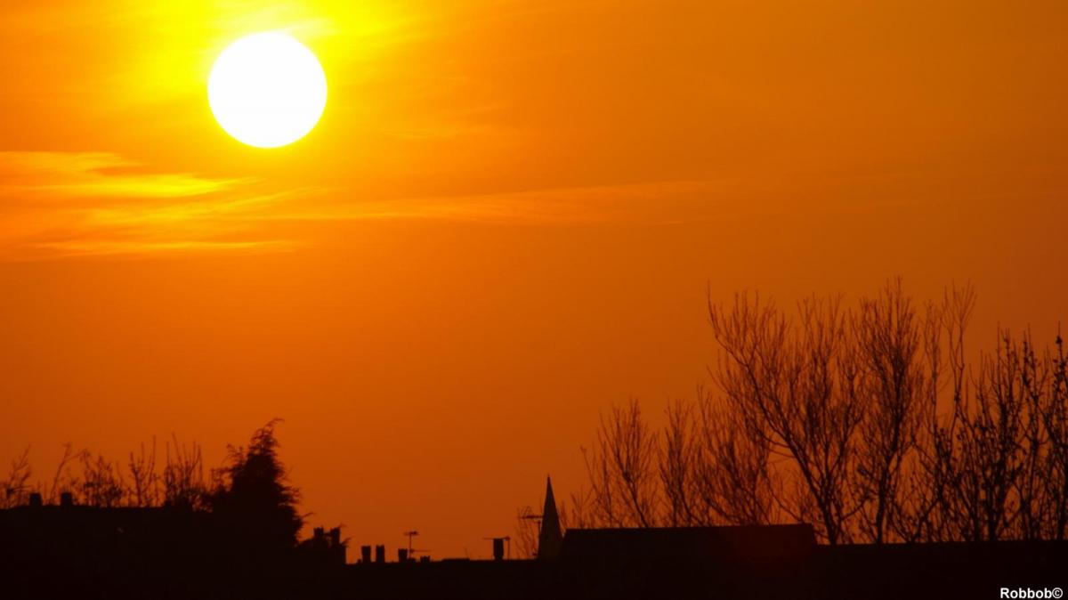 St Peter's Church in Parr provides the perfect background  for contributor Robbob's picture of the setting sun.