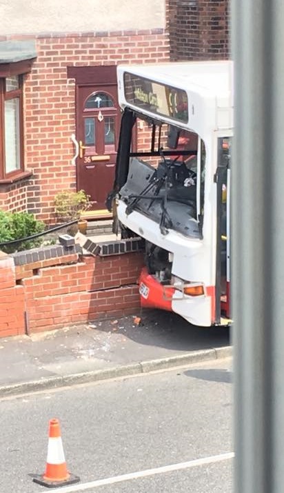 Driver hospitalised after bus smashed into garden wall - St Helens Star