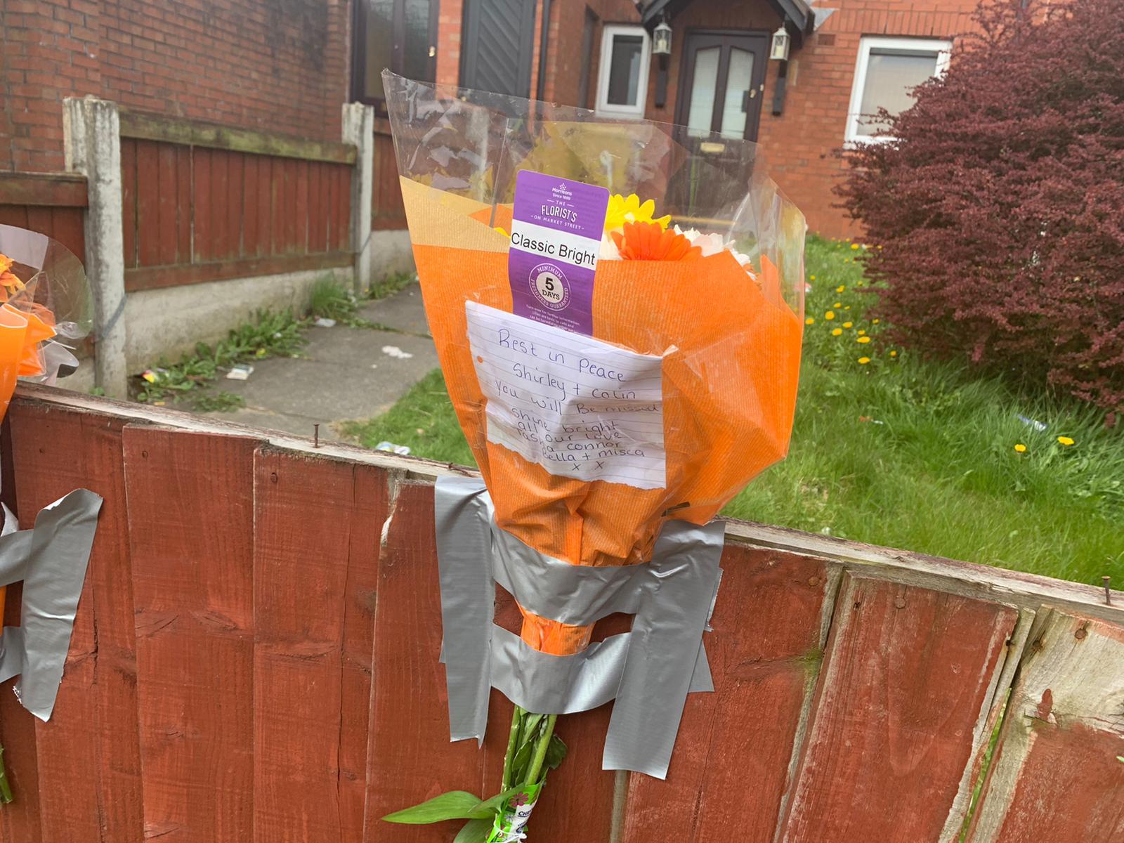 Floral tributes left outside the house on Mersey Street
