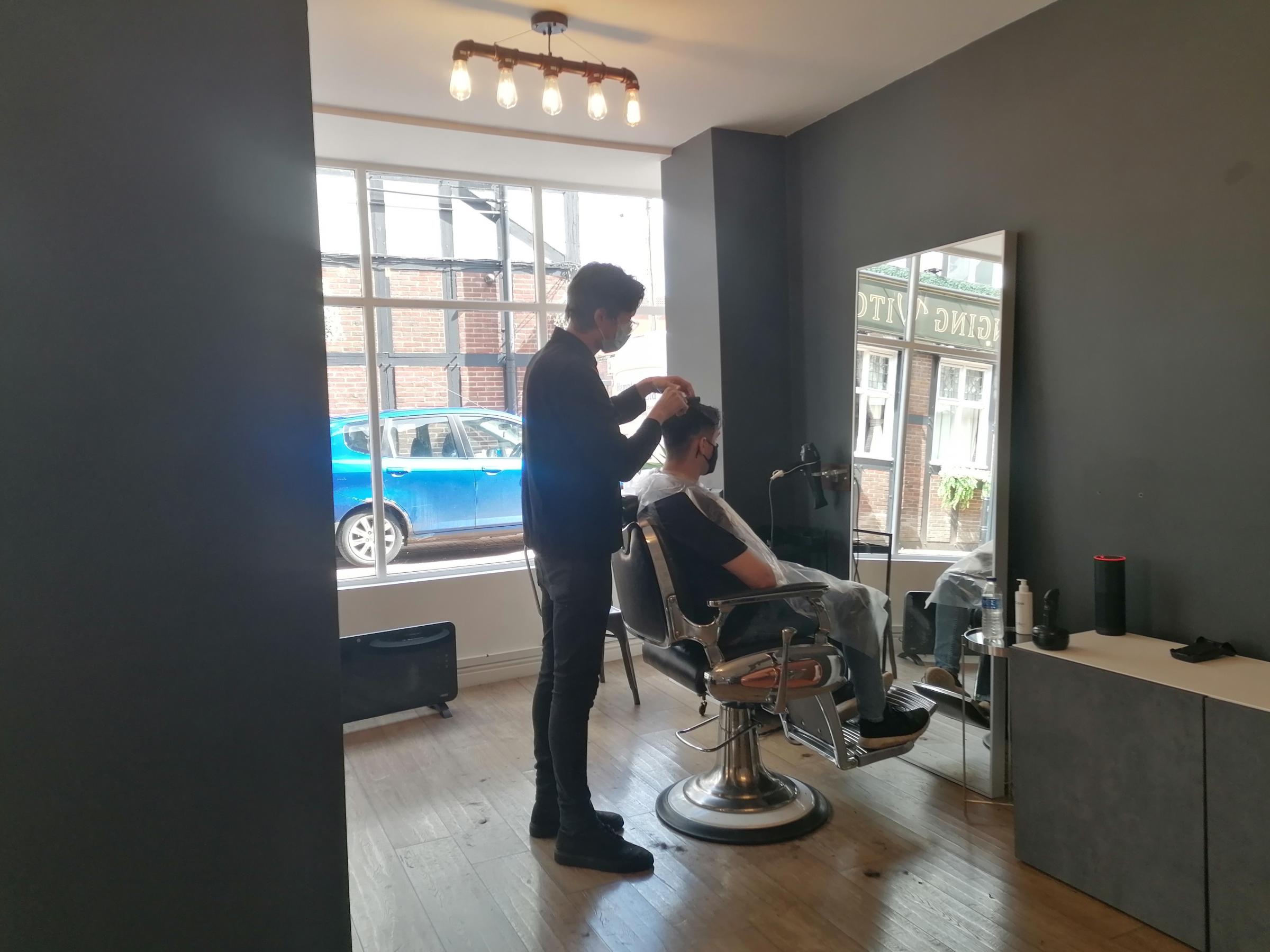 Charles Rose, owner of Crate Cheshire men’s hair salon in Northwich on the first day back behind the barber’s chair after lockdown restrictions are eased