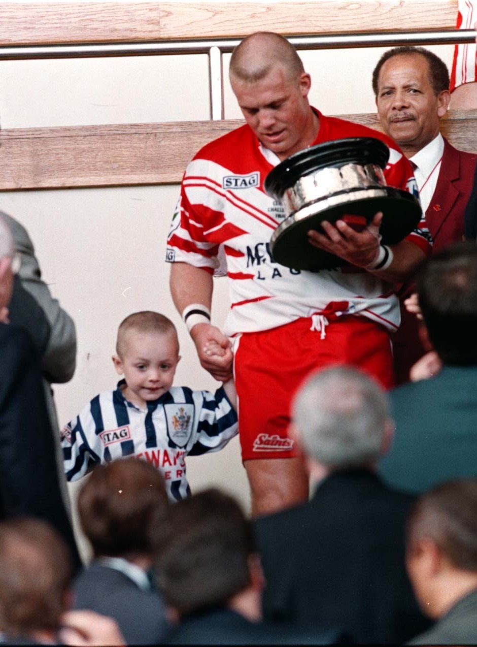 St Helens team captain Bobbie Golding and son of the same name descend the steps to the pitch at Wembley after his side won the Silk Cut Challenge Cup.