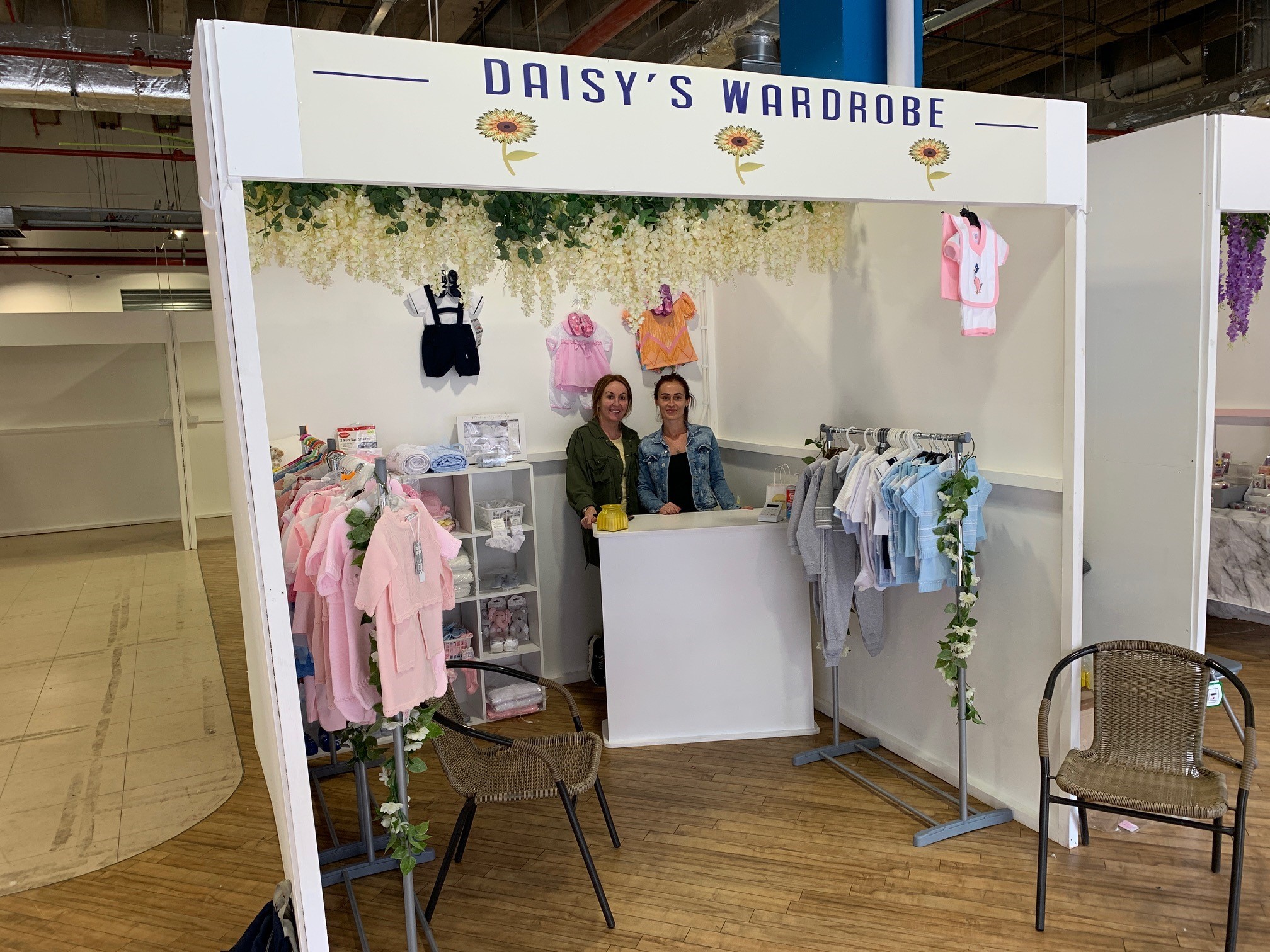 Sophie and Justine at their babywear stall, Daisy's Wardrobe
