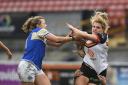 Amy Hardcastle is tough to stop for Leeds Rhinos' Lois Forcell, left, when playing for Bradford two years ago. Picture: SWpix.com