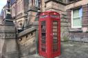 One of the Grade II Listed phone boxes outside St Helens Town Hall