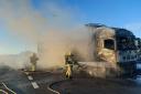 Fire fighters work hard to put out a lorry blaze that has affected traffic on the M6. Photo: North West Motorway Police