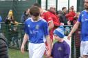 Town’s young winger Harry Long with Garswood Primary mascot