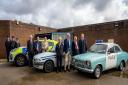 Officers past and present with the former and current police vehicles used at St Helens Police station