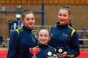 Isobel Stirrup, Jess Lancaster and Lois Preston with their gold medals and Artistry trophy.