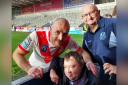 Ben with his stepdad Alan and Saints skipper James Roby