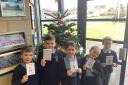 Bleak Hill Primary pupils with some of the Christmas Cards handed out to care home residents