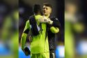 Sam Tickle embraces Manchester United goalkeeper Andre Onana after the cup tie