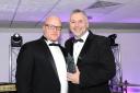 Drive and determination: Ian Smith (right) collects his award from sponsor Glen Moore