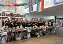 Staff and students alongside their huge collection of food bank donations