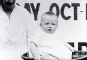 A baby	being weighed in the film St Helens Health Week 1923