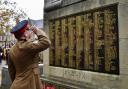 A soldier salutes the fallen in St Helens