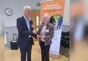 Ann, with Home-Start St Helens chair John Murray, pictured in 2023