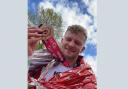 Taylor Prescott with his London Marathon medal