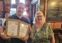 Turks Head landlord Darryl Arrowsmith being awarded the pub's CAMRA award