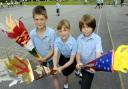 MAGICAL: Bleak Hill Primary School pupils (left to right) Tom Preston, Kerrie-Rose Evans and Ethan Southward will be among 6,000 children lining the Olympic Torch route in St Helens.