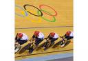 Ed Clancy leads the team pursuit cyclists to a new world record in qualifying.