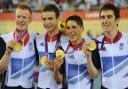 Ed Clancy, left, and the team with their gold medals. Picture by Tom Jenkins/NOPP