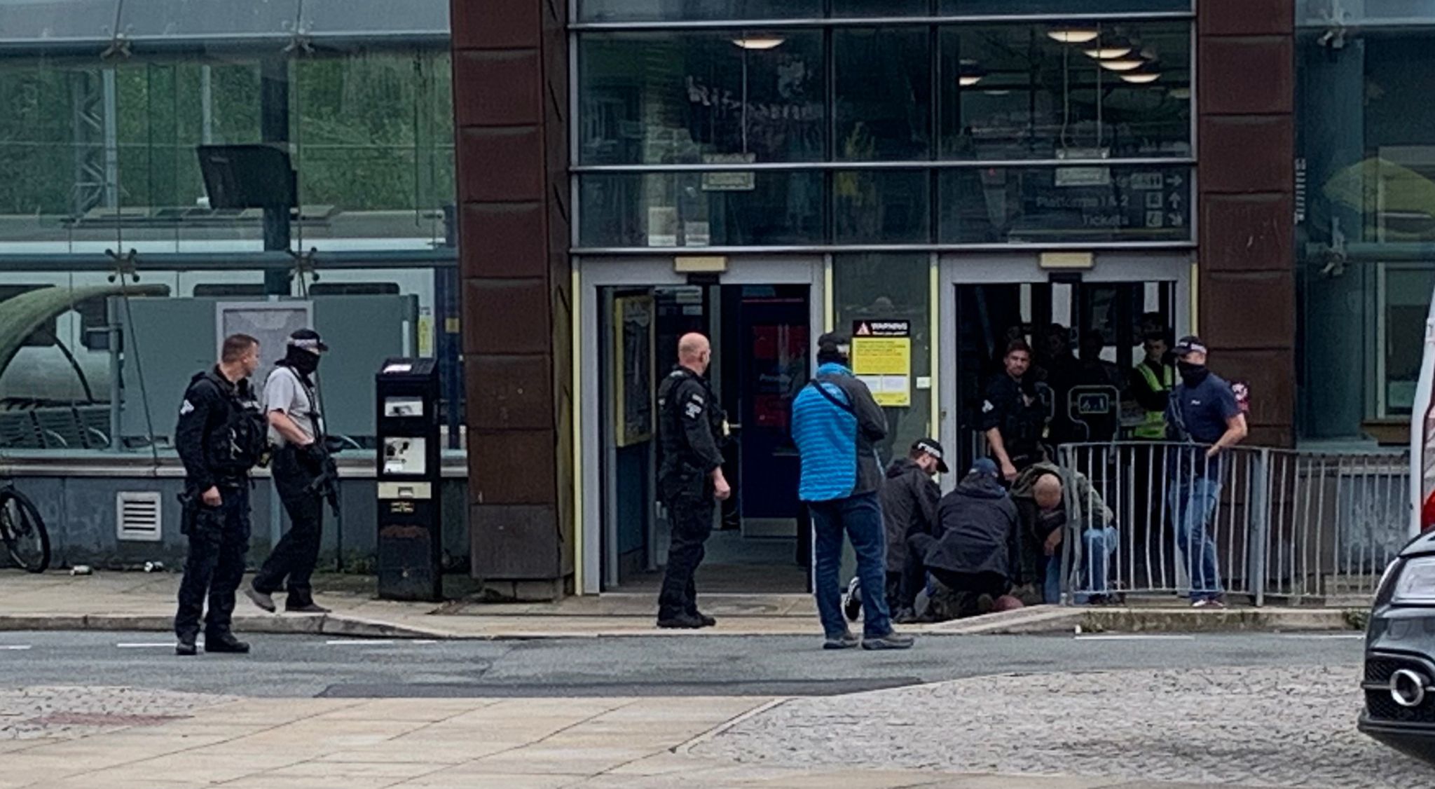 Officers detained a man outside the station