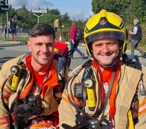 St Helens Star: Ryan Jones and Andy Ball completed the Manchester Marathon in their full firefighting kit and breathing apparatus on Sunday, October 10