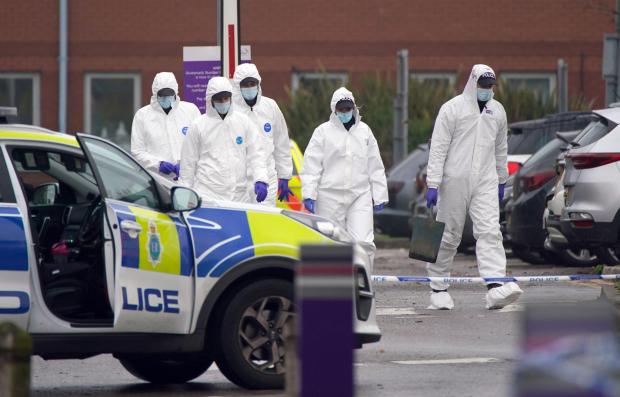 St Helens Star: Forensic officers at Liverpool Women’s Hospital after the explosion. Photo: Peter Byrne/PA