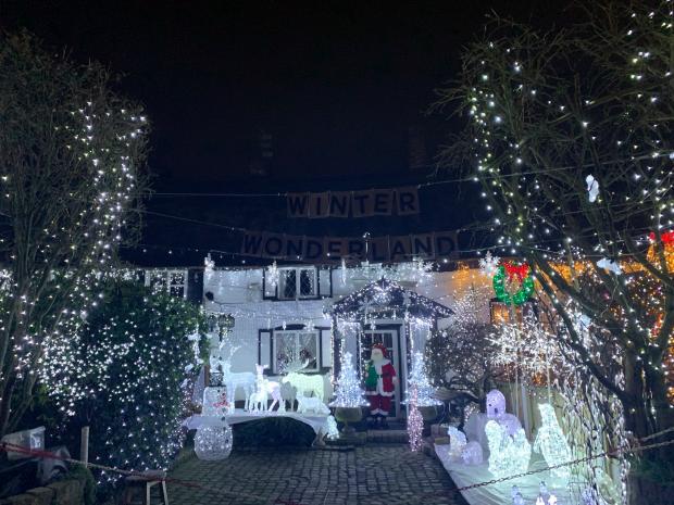 St Helens Star: The Crow Lane cottages have been creating their winter wonderlands for a number of years, raising more than £9,000 for Willowbrook since 2018