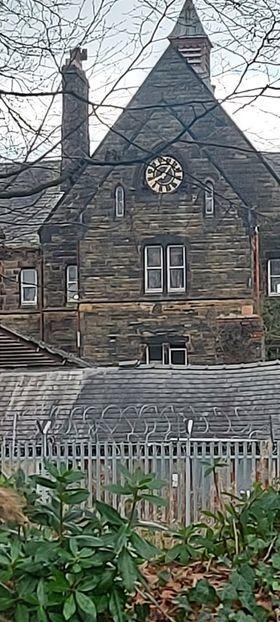 The spooky snap of St Joseph's Seminary, in which three figures can be seen in the window beneath the clock