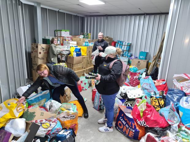 St Helens Star: Volunteers with some of the donated items