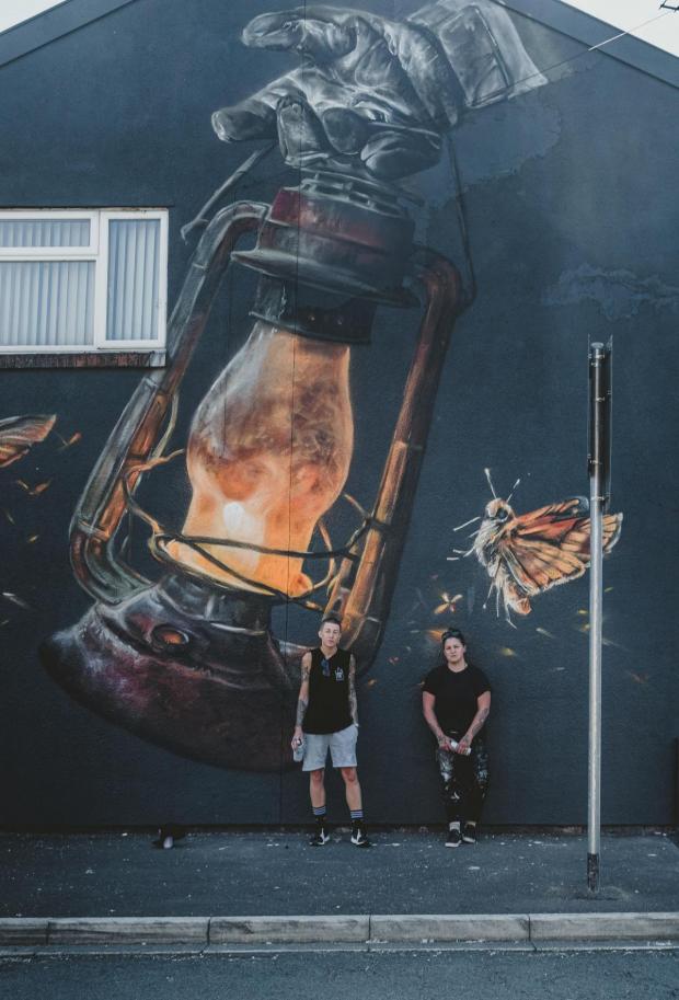 St Helens Star: Artists Nomad Clan outside their mural on Rudd Avenue (Pic: Radka Dolinska)