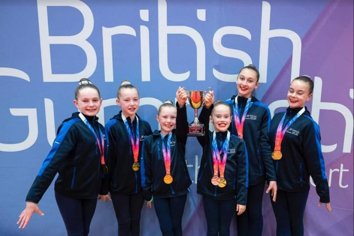 Hope gymnasts celebrate their contribution to the North West's victory in the team competition. Pics: Seam Kilmurray.