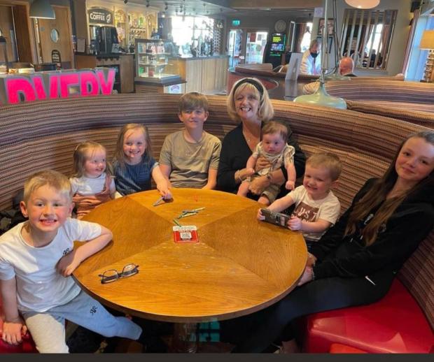 St Helens Star: Karen with all her grandchildren