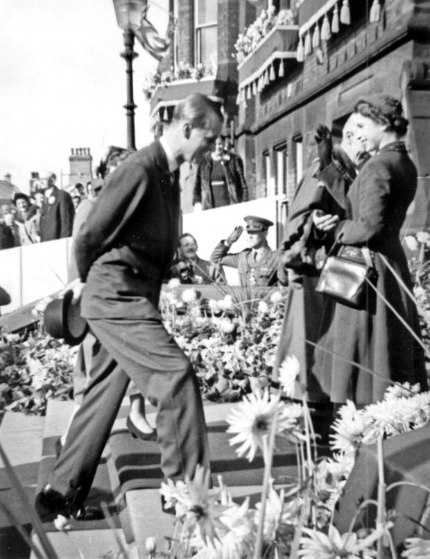 St Helens Star: The Queen	and	Prince Philip	prepare	to enter	the	Town Hall