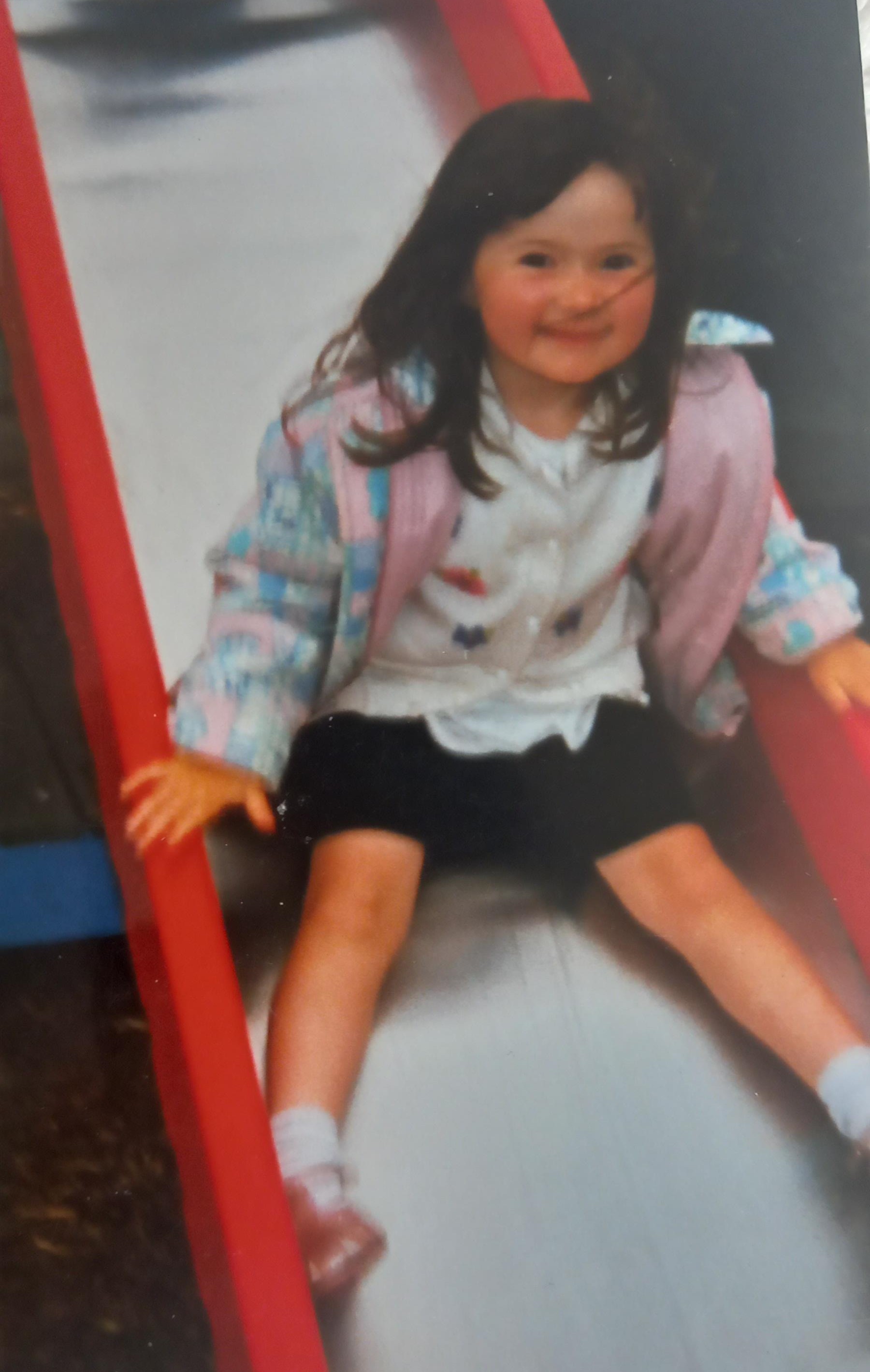 Oliver Sykes sister Amber as a child on a slide in Chapel en le Frith, who was the inspirtion for the character Kezia