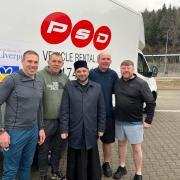 Chris Joynt (second, right), Mike Sharkey (far right), Andy Coley (far left) and Dave Lyon (second left) with Bishop Gregory after the first consignment arrived in March
